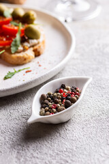 Small bowl with peppercorns on a table