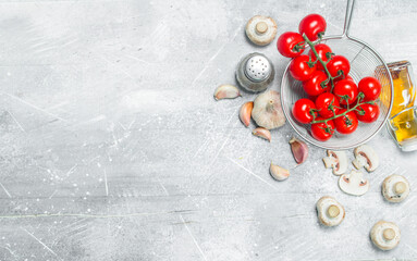 Organic food. Fresh tomatoes with mushrooms and spices.
