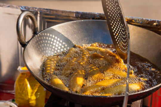 Close-up portrait of Mirchi Bajji at roadside food stall