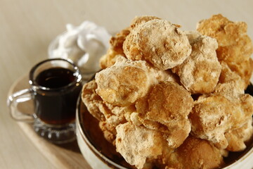 Japanese fried mochi for dessert, with caramelized sugar and whipped cream