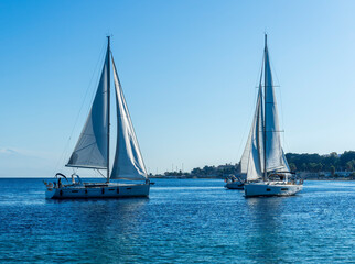 sailing yacht boats with white sails in blue sea , seascape of beautiful ships in sea gulf with...