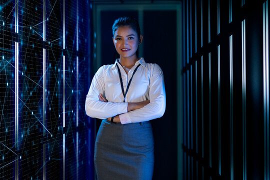 Female technician standing on the server data storage room