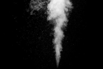 A jet of white water vapor with splashes of water from the humidifier Isolated on a black background. - obrazy, fototapety, plakaty
