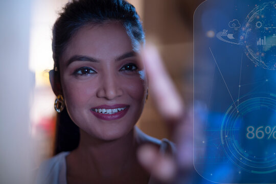 Businesswoman Smiling with icons on virtual screen