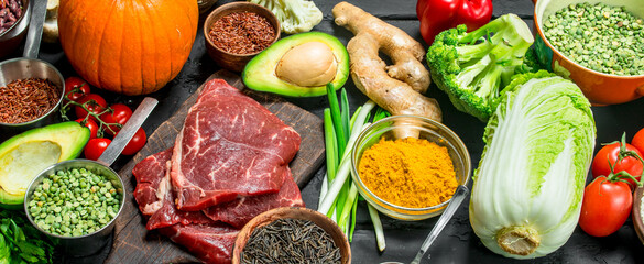 Healthy food. Organic food assortment with raw beef steaks .