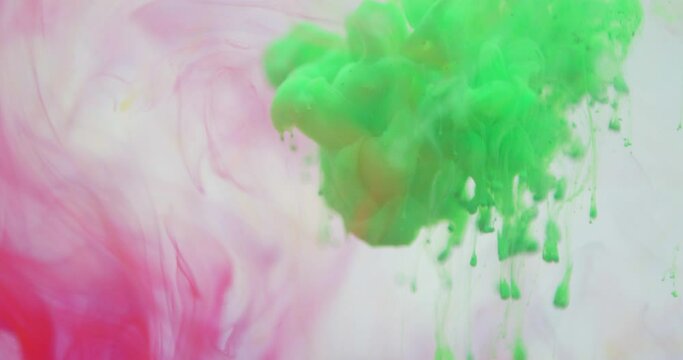 4K footage ,Color paint drops in water ,abstract color mix ,drop of Ink color mix paint falling on water Color ink in water ,Ink splash swirling underwater isolated ,Paint water drop ,Color ink splas