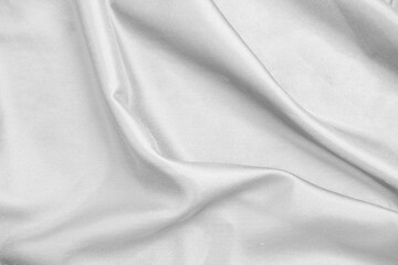 Smooth elegant white silk fabric or satin luxury cloth texture for abstract background