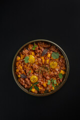 Finely chopped salmon fish named Tartarus. Fish starter. Isolated over black background