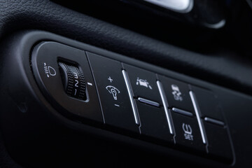 Close-up of the headlight setting buttons. Selective focus.