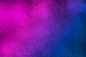 I see black, abstract background with diagonal gradient from blue to pink sprayed with black paint....