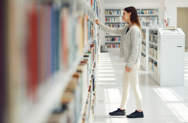 Woman, student and research in library for books, knowledge or learning at bookstore for education. Female looking at bookshelf in study for project, assignment or thesis for college scholarship