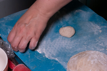 A picture of homemade dough for bread, pastry or cookies on a modern plastic board, capturing the essence of rural home cooking - 561211375