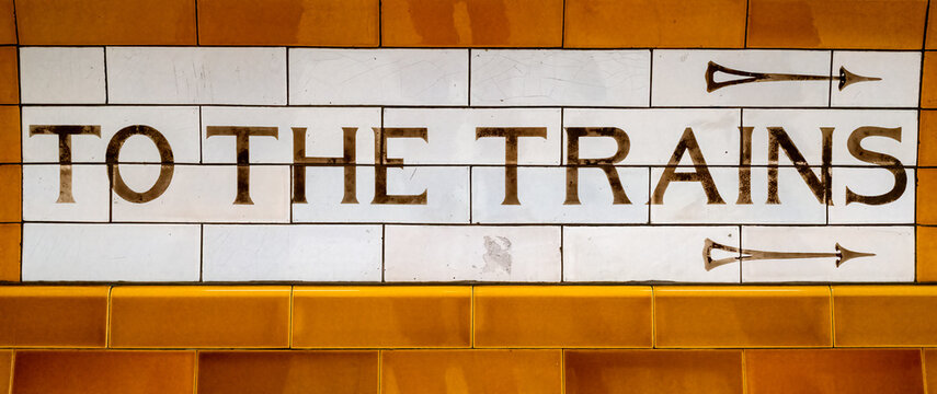 London, UK - 5th January 2023: Art deco To The Trains tiled sign at Covent Garden Underground station, which was opened in 1907 and is on the TFL Piccadilly Line