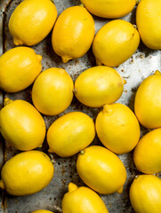 Juicy lemons on a tray.