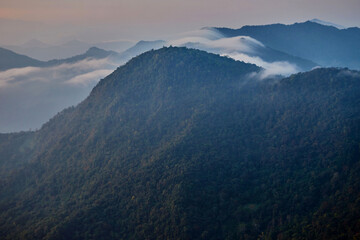 Fog across the mountain peak at Phu Chee Fah in Thailand