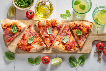 Homemade and tasty pizza on wooden table. Poster for Restaurant.