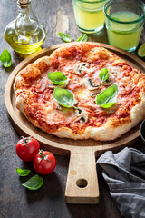 Spicy Capricciosa pizza baked in the oven. Poster for Restaurant.