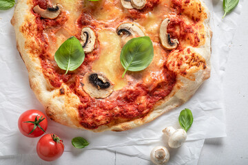Homemade and tasty pizza made of cheese and mushrooms.