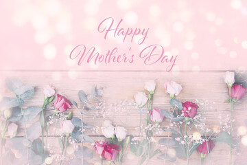 Happy Mother's Day greeting card with beautiful romantic bouquet of flowers on light pink background