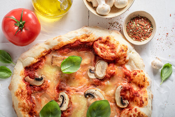 Fresh and aromatic pizza made of cheese and mushrooms.