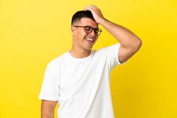 Young handsome man over isolated yellow background has realized something and intending the solution