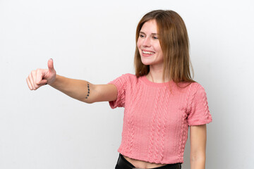 Young English woman isolated on white background giving a thumbs up gesture