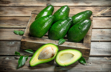 Ripe avocado in a wooden box.