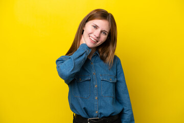 Young English woman isolated on yellow background laughing