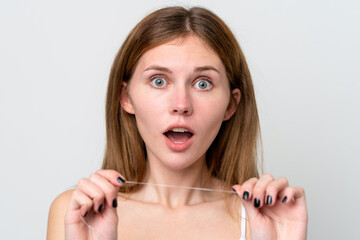 Young English woman with dental floss. Close up portrait