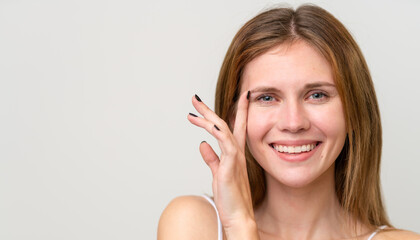 Portrait of pretty young woman over isolated white background