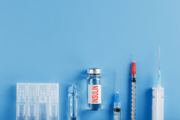 Medicine in ampoules with insulin, needles and syringes for medical subcutaneous injection