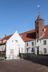 White painted 16th century house with octagonal stair tower in the center of Amersfoort.