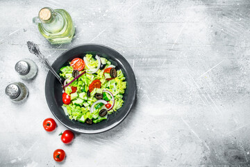 Vegetable salad. Salad of cucumbers, tomatoes and red onions with spices and olive oil.