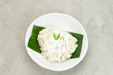 Ketan Kelapa Parut, Indonesian traditional snack, made from steamed glutinous rice and served with grated coconut
