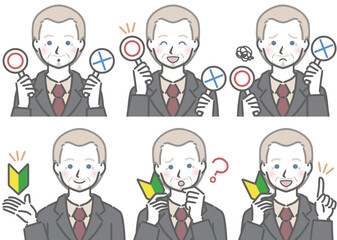 〇✕マークや初心者マークを持つ、スーツを着た高齢の白人男性