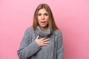 Young caucasian woman isolated on pink bakcground pointing to oneself