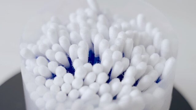 Cotton buds spin on a turntable. Close-up.