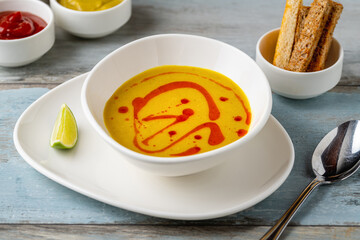 Strained lentil soup on a white porcelain plate