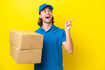 Delivery handsome man isolated on yellow background intending to realizes the solution while lifting a finger up