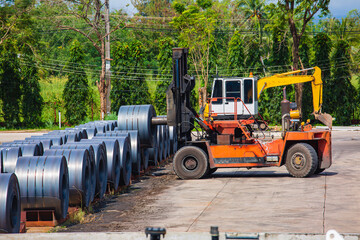 Rolls of carbon steel sheets outside the factory