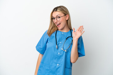 Young surgeon doctor woman isolated on white background saluting with hand with happy expression