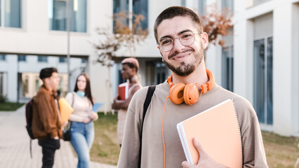 Happy caucasian student smiling to the camera