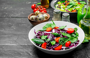 Vegetable salad. A variety of organic salads, vegetables with olive oil and spices .
