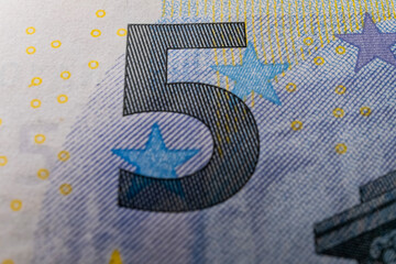 A macro image of the special ink on a Euro banknote, showcasing the security measures in place to prevent counterfeiting, including the multicolor microprint feature - 561238371