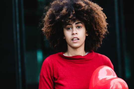 Surprised African American Girl With A Red Heart For Valentine