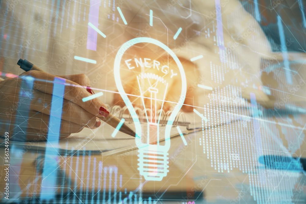 Poster bulb hologram over hands taking notes background. concept of idea. double exposure