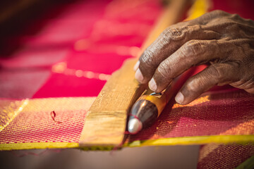 Knchipuram handloom weaver hand crafted closeup shot. The Kanchipuram silk sari is a type of silk...