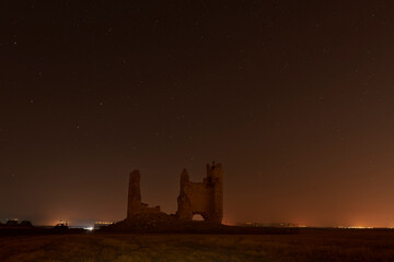 Caudilla castle in ruins at night with the Milky Way. Spain