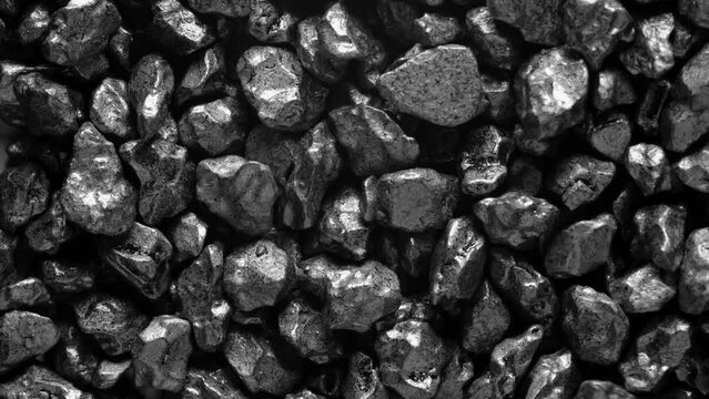 Close-up of a black stones surface moving.