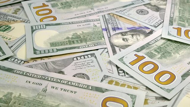 Lots of money. Dollar bill close-up. Income, capital and wealth. Enrichment with 100 US dollar bills. Bank savings.